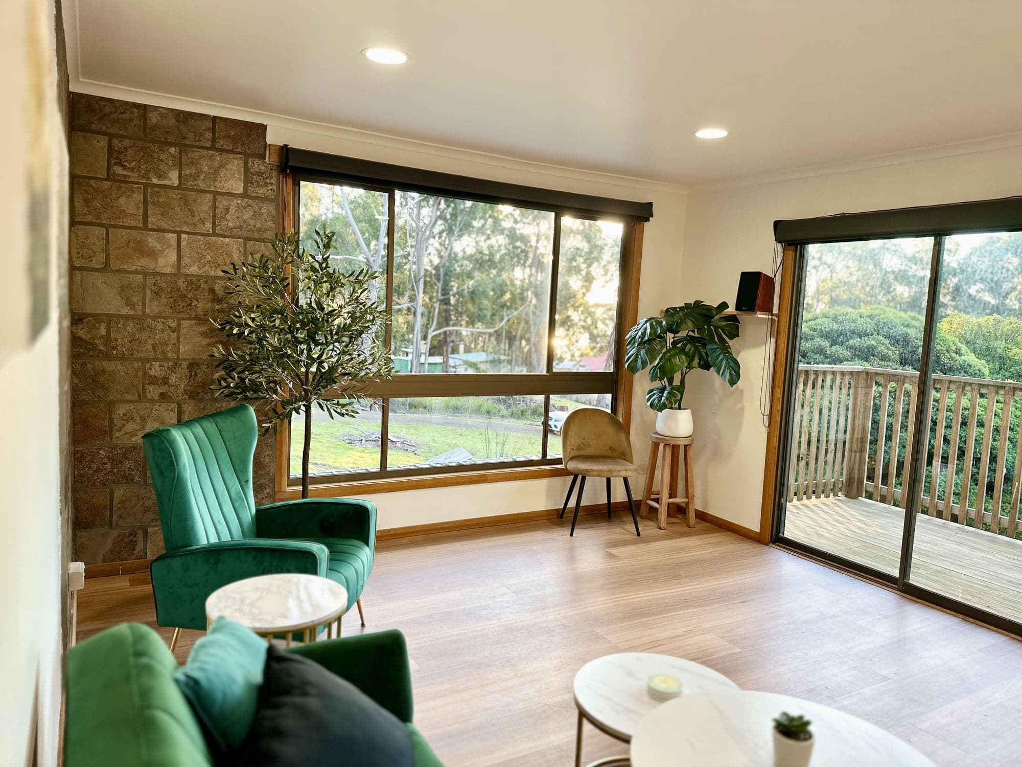 LunaStay — living area opening onto the timber deck and bush beyond